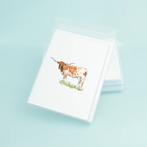 Greeting card featuring a watercolor illustration of a Texas Longhorn steer on eco-friendly linen paper.