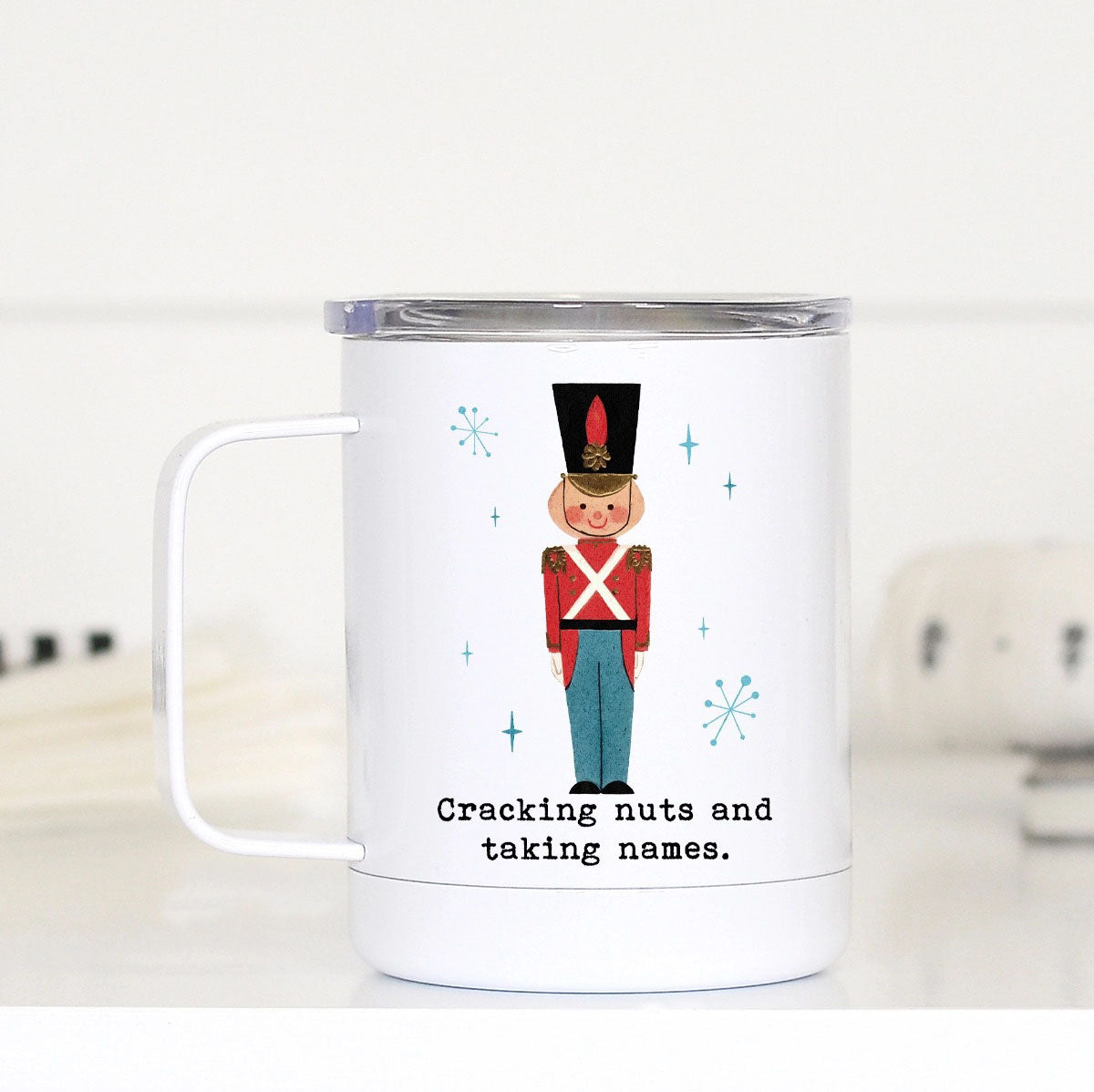 Cracking Nuts Funny Christmas Travel Cup - 12 oz Stainless Steel Mug with Nutcracker Holiday Design.