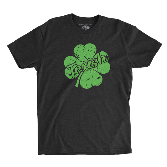 Texish Texas T-Shirt featuring a green shamrock with Texish emblem for St. Patrick’s Day celebrations.